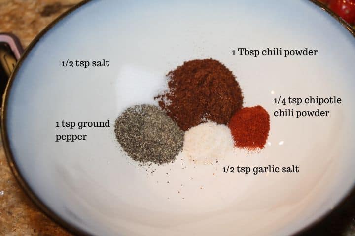 a bowl with chili seasonings and the ingredients listed