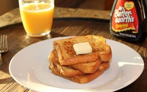 a delicious stack of french toast on a plate.