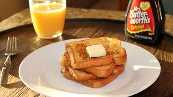 a delicious stack of french toast on a plate.