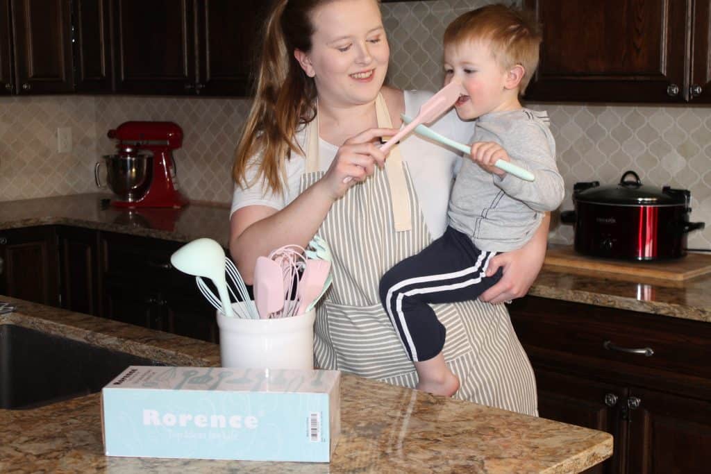 mom and kid having fun with rorence kitchen utensils