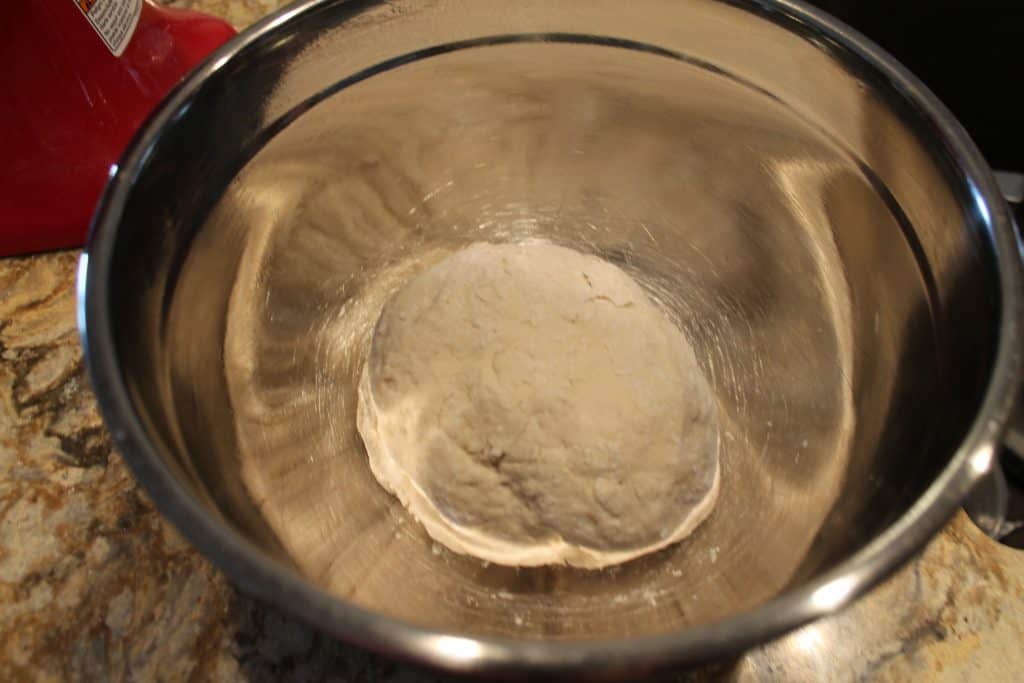 the breadstick dough in a well oiled bowl that need to rise for an hour