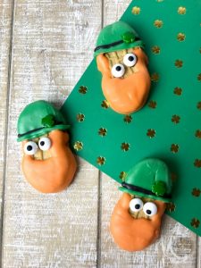 nutter butter cookies decorated to look like leprechauns