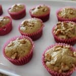 a serving tray with homemade banana nut muffins