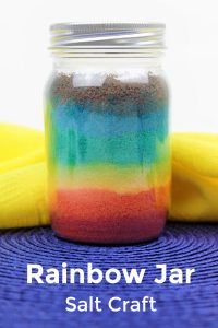 mason jar filled with different colored salt to make a rainbow