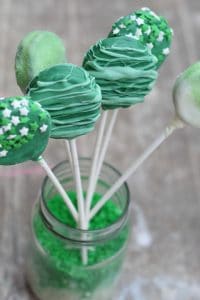 oreo cookie pops decorated in green icing