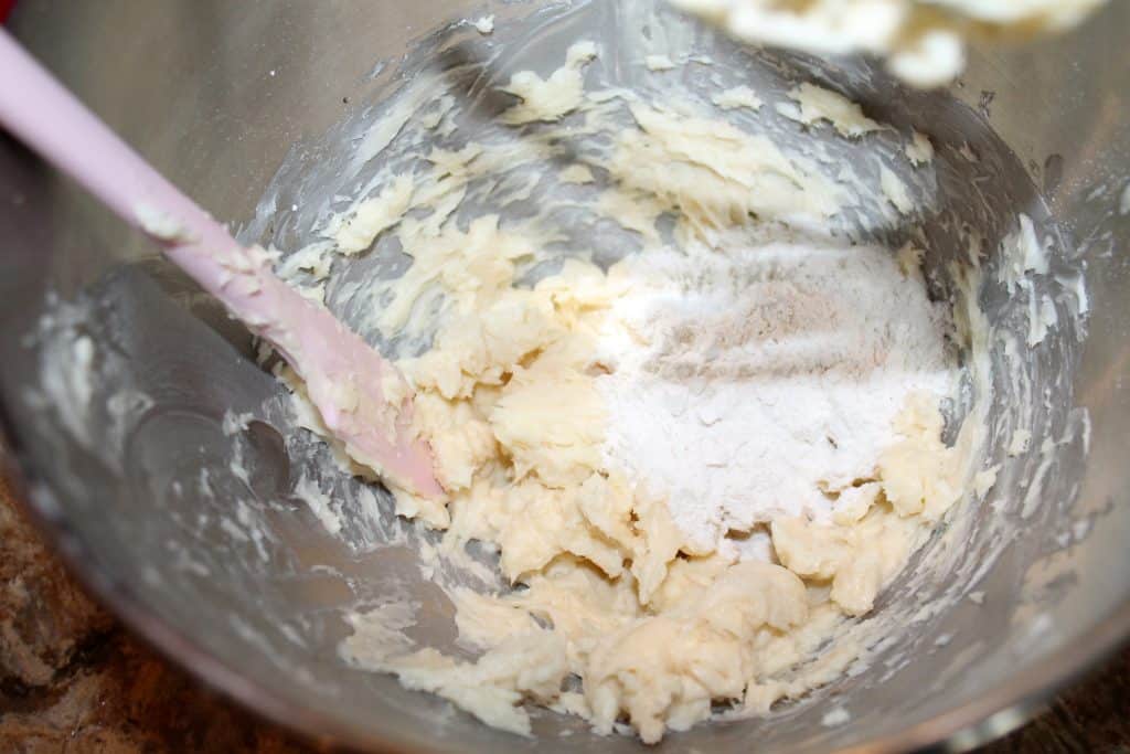 mixing bowl with all purpose flour added to the butter mixture