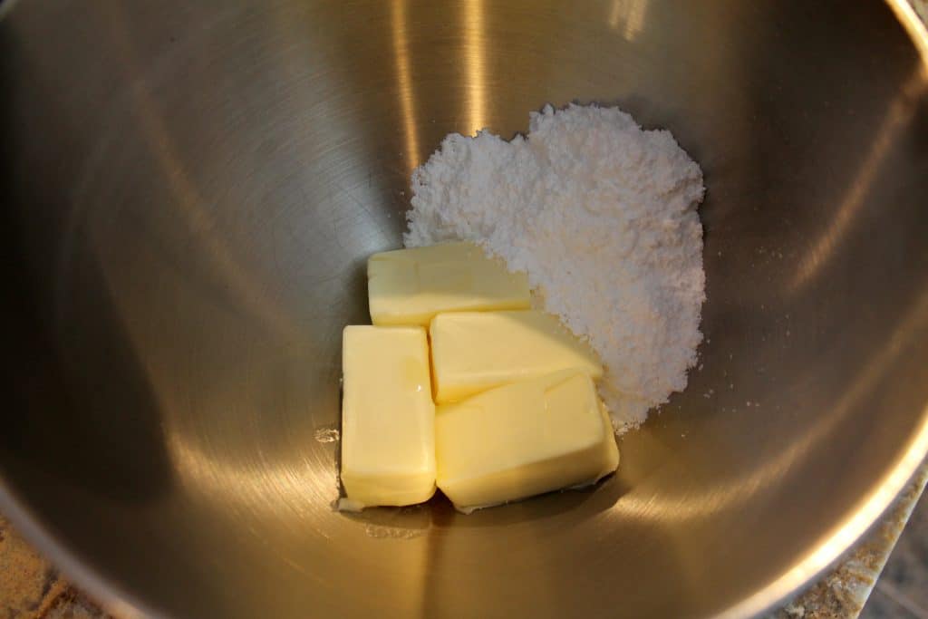 mixing bowl with softened butter and powdered sugar