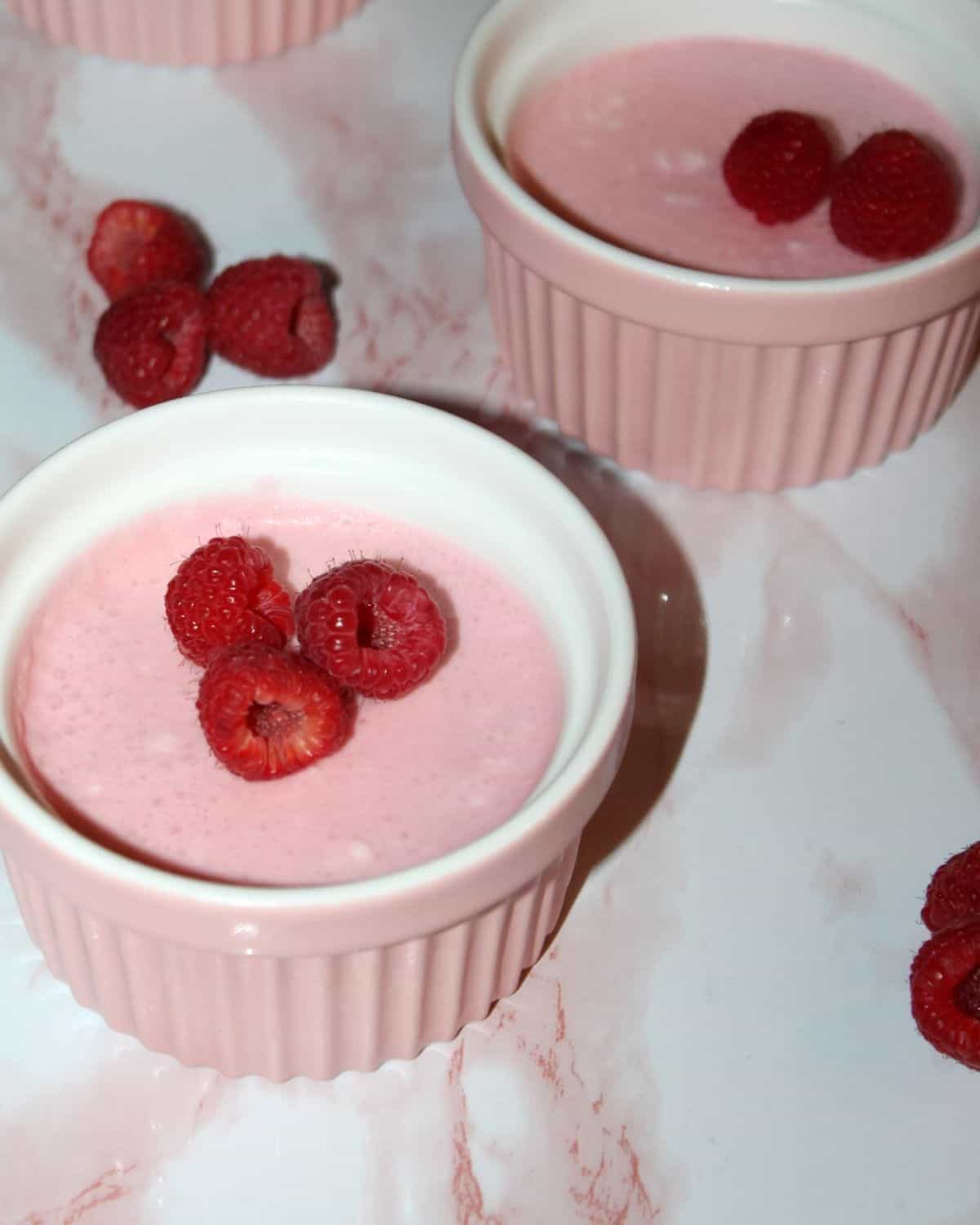 raspberry mousse in pink ramekins