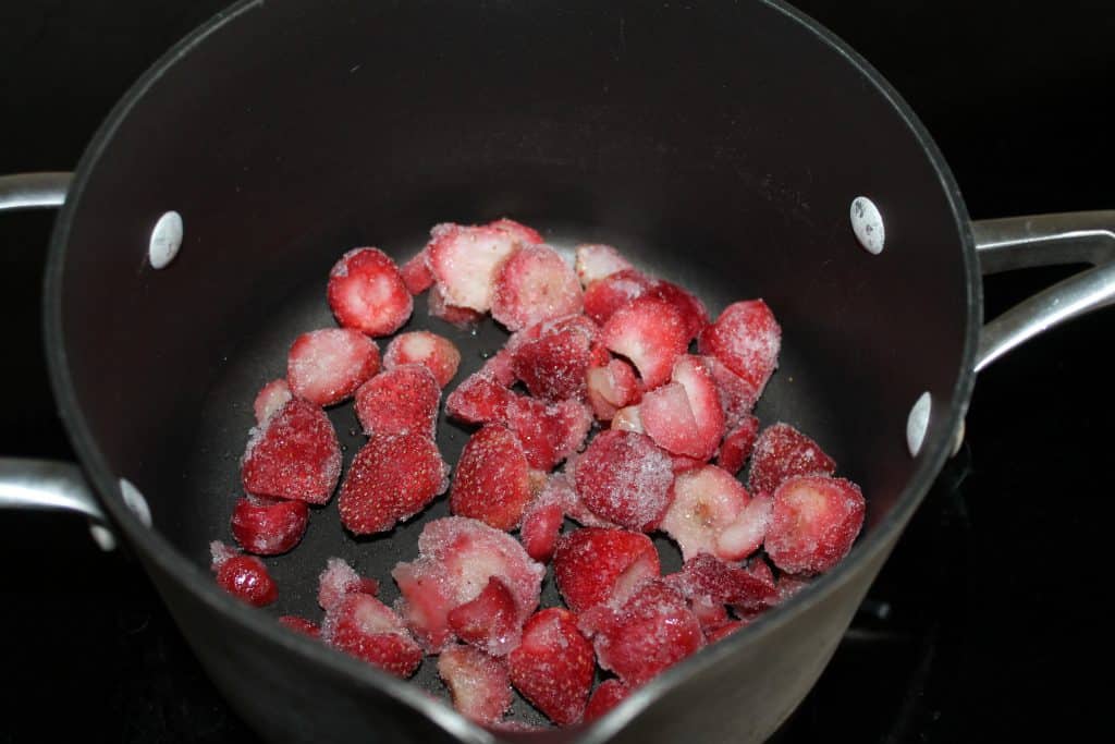 frozen strawberries in a saucepan