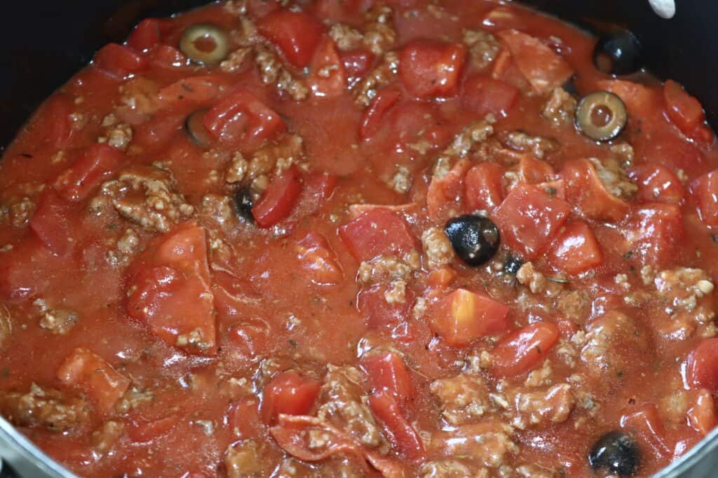 a five quart sauce pan with the finished pizza soup in it