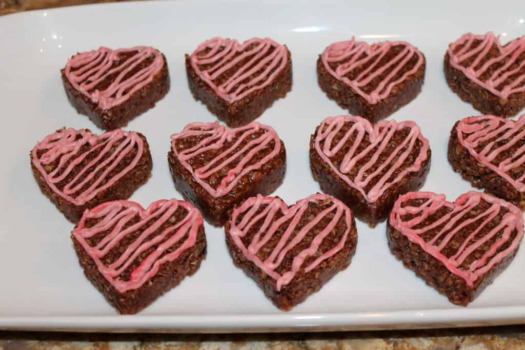 a plate full of decorated no bake cookies