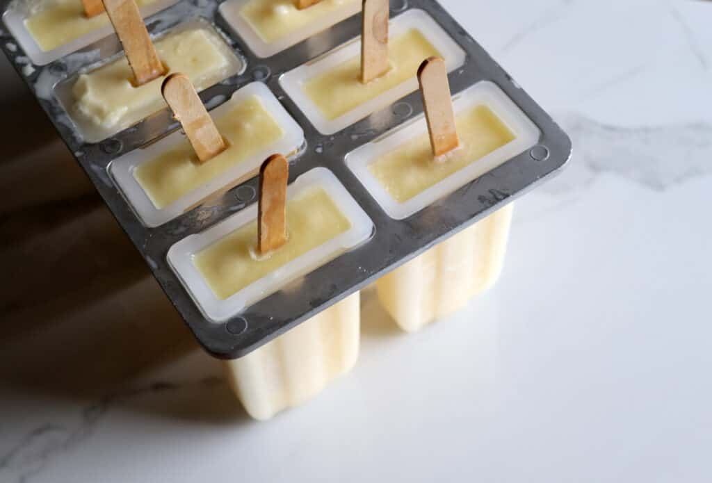 frozen creamsicles in a popsicle mold