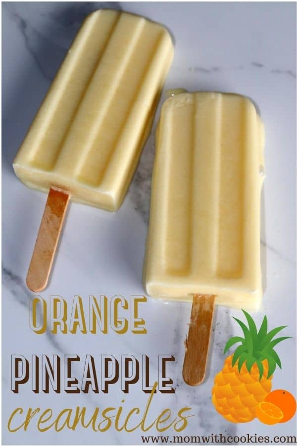 orange pineapple creamsicles on a marble plate