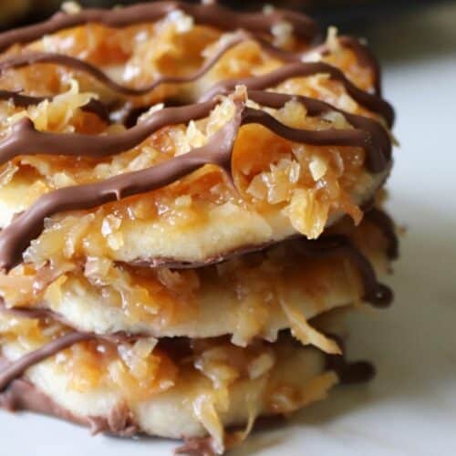 three homemade samoas cookies stacked on top of each other