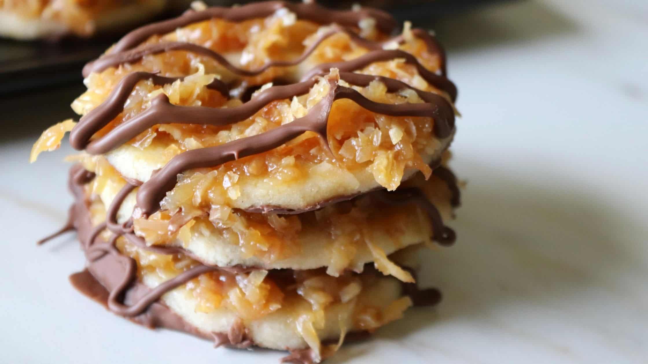 three homemade samoas cookies stacked on top of each other