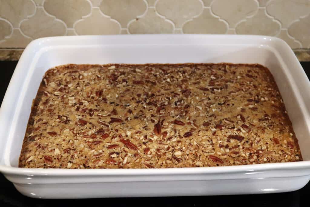 pecan pie bars in a ceramic 9x12 baking dish