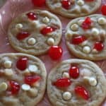 a plate of white chocolate cherry cookies freshly baked