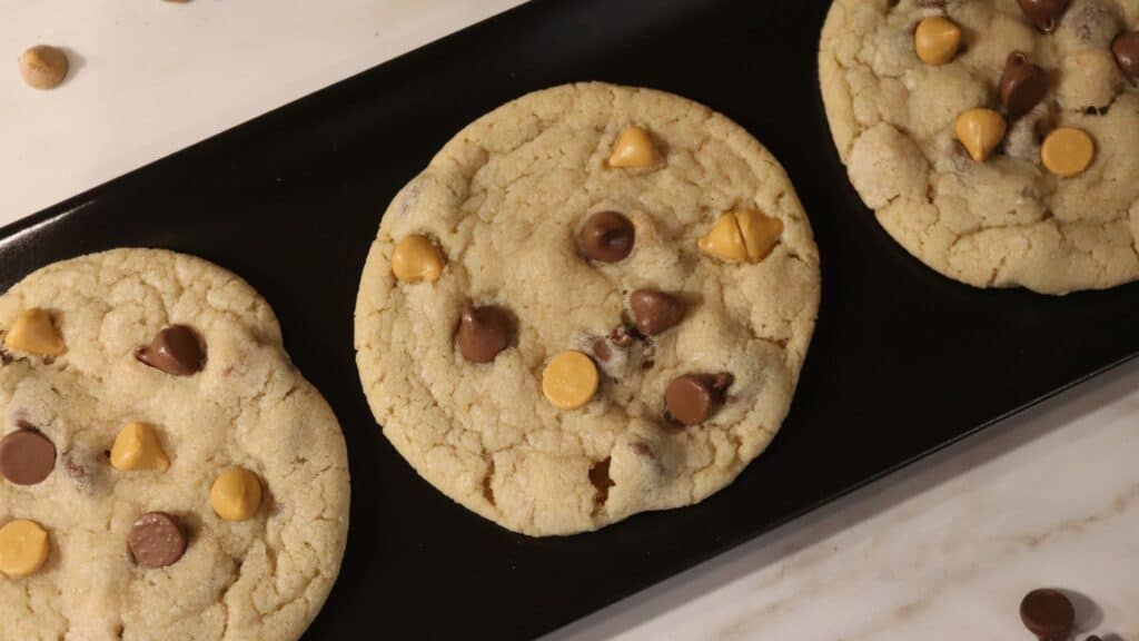 butterscotch chocolate chip cookies on a black serving plate