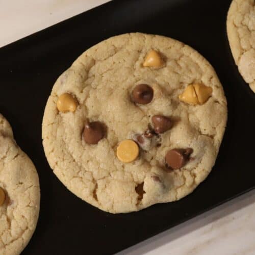 butterscotch chocolate chip cookies on a black serving plate