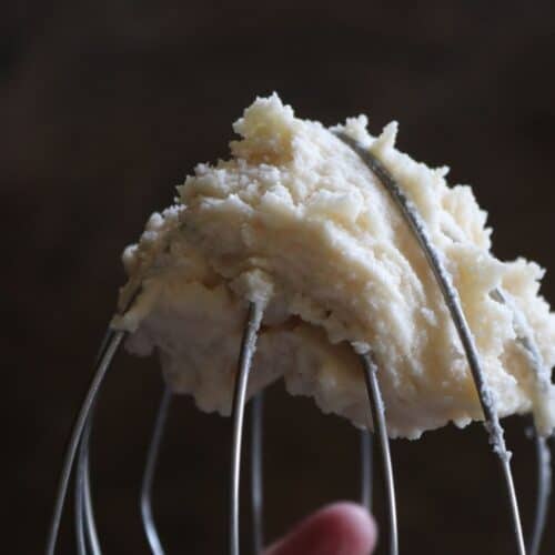 a whisk with brown butter frosting