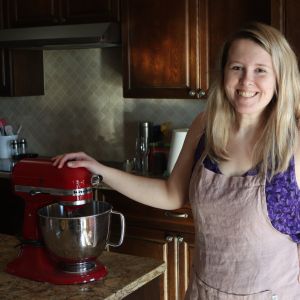 Joanna Stephens standing by a kitchenaid mixer