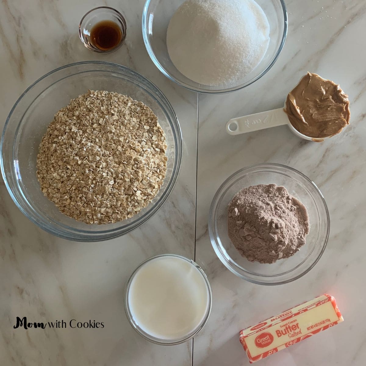 oats vanilla extract sugar peanut butter chocolate protein powder milk and butter all in measuring bowls